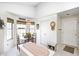 Sunlit breakfast nook with a dining table, a bay window, and white walls that add to the bright atmosphere at 7114 Hickory Rd, Indianapolis, IN 46259