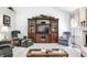 Inviting living room with a large entertainment center, comfortable seating, and bright lighting at 7114 Hickory Rd, Indianapolis, IN 46259