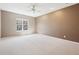 Bedroom featuring light carpet, neutral walls and large window with bright sunlight at 720 Bucksport Ln, Westfield, IN 46074