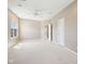 Large bedroom boasts a window, ceiling fan, carpet, and white trim for a bright and open feel at 720 Bucksport Ln, Westfield, IN 46074