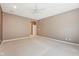 Neutral bedroom featuring carpet floors, a ceiling fan, and an open doorway at 720 Bucksport Ln, Westfield, IN 46074