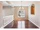 Hardwood floor dining room with natural light from the window and traditional chandelier at 720 Bucksport Ln, Westfield, IN 46074