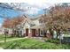 Well-maintained townhome exterior with brick accents, front porch swing, and lovely landscaping at 720 Bucksport Ln, Westfield, IN 46074