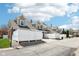 Inviting townhomes with brick and neutral siding, white fences, and well-maintained landscaping at 720 Bucksport Ln, Westfield, IN 46074