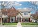 Charming two-story home with brick and siding, a covered front porch, and a beautifully landscaped yard at 720 Bucksport Ln, Westfield, IN 46074
