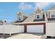 Attractive townhome exterior featuring a two-car garage, brick details, and neat landscaping at 720 Bucksport Ln, Westfield, IN 46074