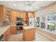 Kitchen featuring stainless steel appliances, an island and a window overlooking the backyard at 720 Bucksport Ln, Westfield, IN 46074