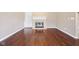 Living room with hardwood floors, fireplace, and built-in shelving, creating a cozy space at 720 Bucksport Ln, Westfield, IN 46074