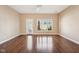 Bright living room with hardwood floors, neutral walls, ceiling fan and lots of natural light at 720 Bucksport Ln, Westfield, IN 46074
