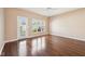 Bright living room with hardwood floors, neutral walls, ceiling fan and access to the backyard at 720 Bucksport Ln, Westfield, IN 46074