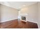 Bright living room with hardwood floors, fireplace, and built-in shelving at 720 Bucksport Ln, Westfield, IN 46074