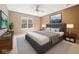 Cozy main bedroom featuring a ceiling fan, neutral walls, and comfortable furniture at 720 Bucksport Ln, Westfield, IN 46074