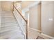 Carpeted staircase featuring white railings and wooden posts, leading to the upper level of the home at 720 Bucksport Ln, Westfield, IN 46074