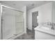 This modern bathroom includes a step-in shower and a double sink vanity at 7265 Governors Row, Avon, IN 46123