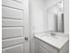 Bright bathroom featuring a single sink with white cabinets and a modern faucet with a framed mirror at 7265 Governors Row, Avon, IN 46123