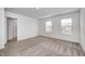 This is a bright bedroom featuring two windows and a closet with plenty of space at 7265 Governors Row, Avon, IN 46123