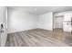 Well lit living area featuring stylish flooring, a bright window, and a doorway to the kitchen at 7265 Governors Row, Avon, IN 46123