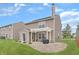 Charming backyard with a covered patio, a well-manicured lawn, and a neutral color scheme, perfect for outdoor living at 7860 Sergi Canyon Dr, Indianapolis, IN 46217