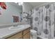 Cozy bathroom featuring a vanity with a sink, toilet, and stylish shower curtain creating a relaxing, functional space at 7860 Sergi Canyon Dr, Indianapolis, IN 46217