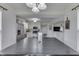 Bright dining area with a modern chandelier that opens to an adjacent kitchen at 7860 Sergi Canyon Dr, Indianapolis, IN 46217