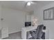 Bright home office featuring a white desk, comfortable black leather chair, and neutral walls creating a professional space at 7860 Sergi Canyon Dr, Indianapolis, IN 46217