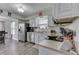 Bright kitchen features white cabinets, stainless steel appliances and updated countertops at 7860 Sergi Canyon Dr, Indianapolis, IN 46217