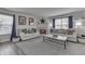 Comfortable living room featuring two sofas, a fireplace and neutral tones at 7860 Sergi Canyon Dr, Indianapolis, IN 46217
