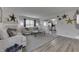 Inviting living room with a cozy fireplace, neutral tones, and seamless flow into the adjacent kitchen at 7860 Sergi Canyon Dr, Indianapolis, IN 46217