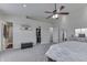 Bright bedroom features carpet, natural light, a ceiling fan, and closet at 7860 Sergi Canyon Dr, Indianapolis, IN 46217