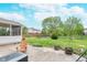 Spacious backyard with patio, featuring lush greenery and mature trees, perfect for outdoor enjoyment at 8181 Fairway Dr, Brownsburg, IN 46112