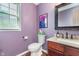 Charming powder room with granite countertop, decorative mirror, and stylish fixtures at 8181 Fairway Dr, Brownsburg, IN 46112