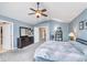 Bright bedroom with a vaulted ceiling, ceiling fan, dresser, and neutral carpet at 8181 Fairway Dr, Brownsburg, IN 46112