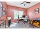 Bedroom featuring a built-in desk, a window with natural light, and stylish decor, ideal for work or study at 8181 Fairway Dr, Brownsburg, IN 46112