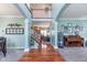Elegant foyer featuring high ceilings, hardwood floors, and views into the adjacent living spaces at 8181 Fairway Dr, Brownsburg, IN 46112