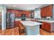 Well-designed kitchen featuring stainless steel appliances, wooden cabinetry, and kitchen island at 8181 Fairway Dr, Brownsburg, IN 46112