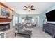 Inviting living room featuring a fireplace, neutral walls, and comfortable seating at 8181 Fairway Dr, Brownsburg, IN 46112