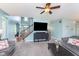 Cozy living room with plenty of space, a large window, and stairway at 8181 Fairway Dr, Brownsburg, IN 46112