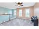 Open loft area with a view of the floor below, offering versatile space for a home office or entertainment at 8181 Fairway Dr, Brownsburg, IN 46112