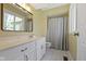 The bathroom has a vanity, mirror, and shower with tub at 8218 San Carlos Ct, Indianapolis, IN 46256