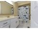 Bathroom featuring a vanity with a marble countertop and a shower with a fun shower curtain at 8218 San Carlos Ct, Indianapolis, IN 46256