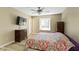 This bedroom features a ceiling fan, a dresser, and natural light at 8218 San Carlos Ct, Indianapolis, IN 46256