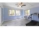 Bright bonus room featuring tile floors, multiple windows, and a ceiling fan at 8218 San Carlos Ct, Indianapolis, IN 46256