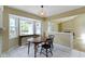 Dining area with bay window, pendant lighting, and a view into the living room at 8218 San Carlos Ct, Indianapolis, IN 46256