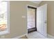 Entryway with a beige wall, window on the left, and door to the exterior with glass panes at 8218 San Carlos Ct, Indianapolis, IN 46256