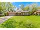 Charming single-story brick home with an attached two-car garage and beautiful lawn at 8218 San Carlos Ct, Indianapolis, IN 46256