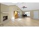 Living room with a vaulted ceiling, fireplace, hardwood floors, and grand piano at 8218 San Carlos Ct, Indianapolis, IN 46256