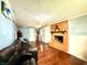 Cozy basement area with brick fireplace and comfortable seating at 8231 Trevellian Way, Indianapolis, IN 46217