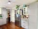 Modern kitchen featuring stainless steel refrigerator and granite countertops at 8231 Trevellian Way, Indianapolis, IN 46217