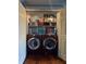 Laundry closet featuring matching washer and dryer units and plenty of shelving at 8231 Trevellian Way, Indianapolis, IN 46217