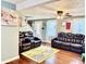 Spacious living room with plush leather seating and bright, airy feel at 8231 Trevellian Way, Indianapolis, IN 46217